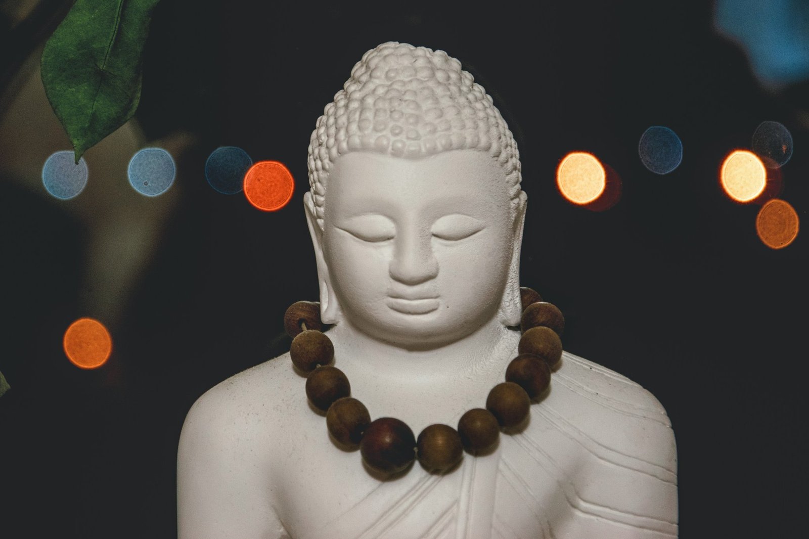 Happy man smiling while holding a smartphone with Buddhify app open