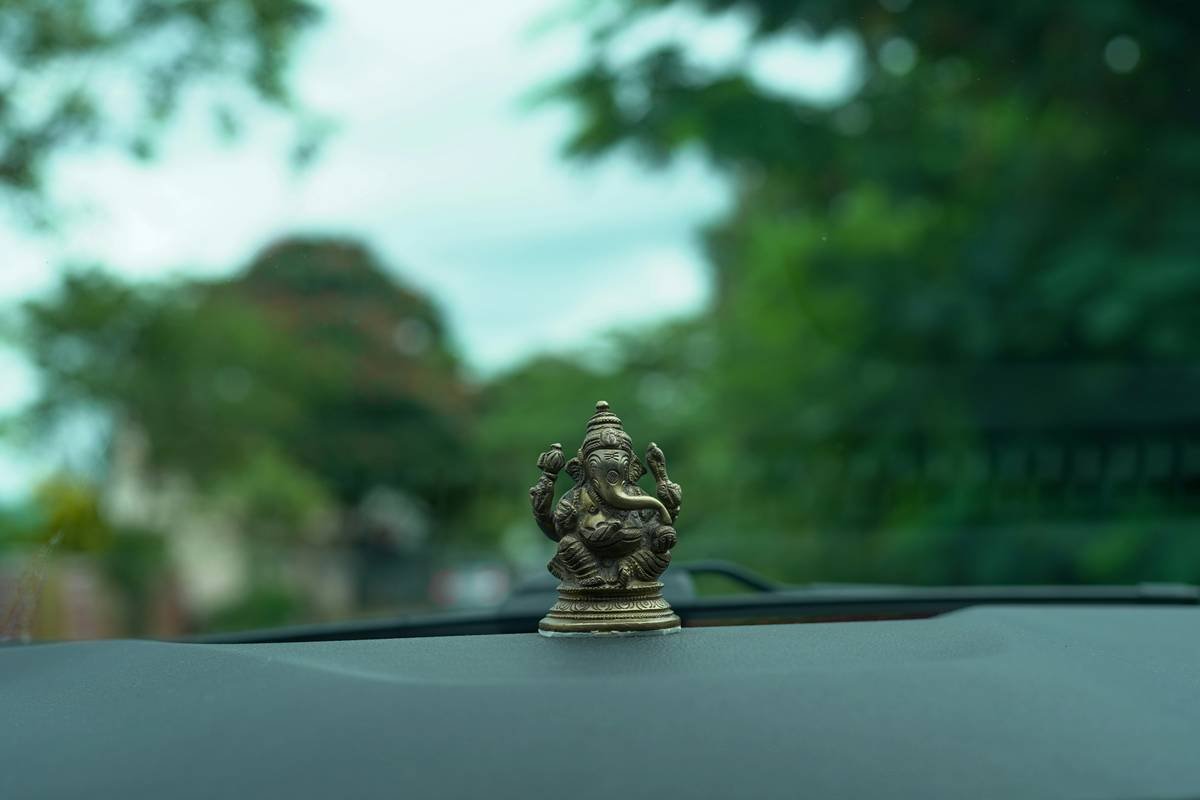 A person wearing headphones and meditating while commuting on public transport